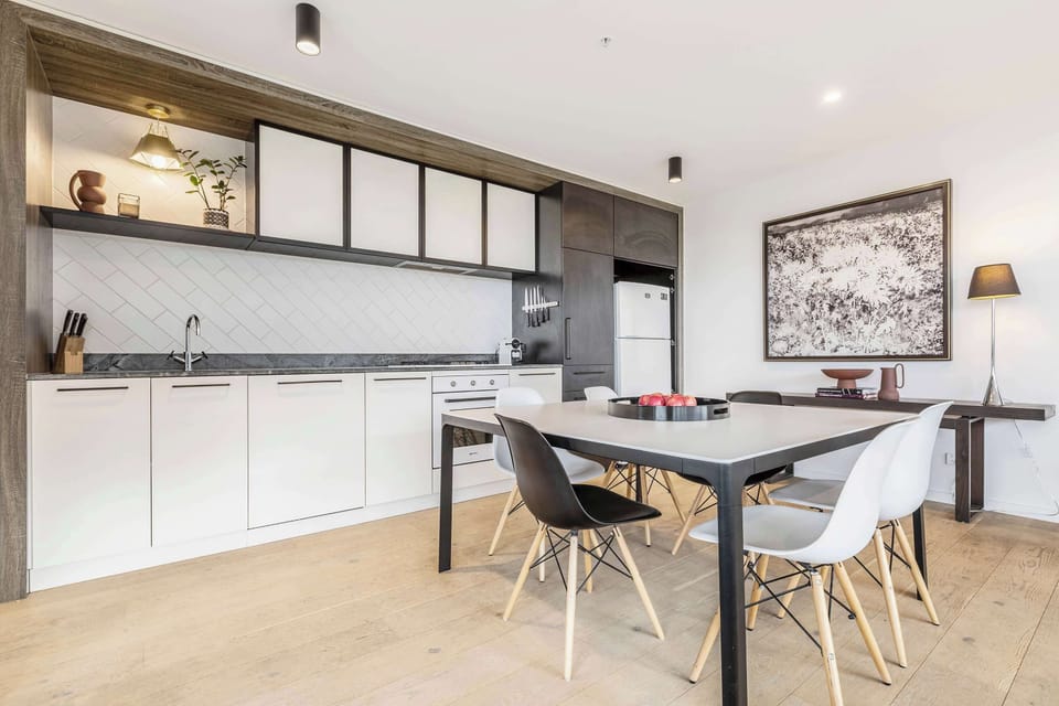 DINING AREA: A welcoming space with seating and dining for six, designed for shared meals, relaxed gatherings, and effortless connection