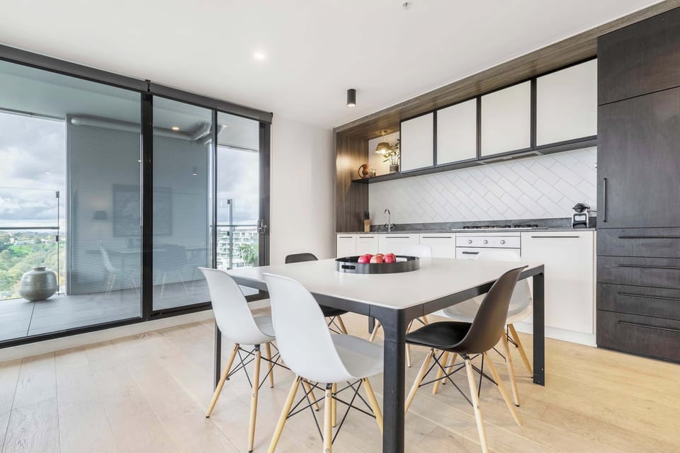 DINING AREA: A welcoming space with seating and dining for six, designed for shared meals, relaxed gatherings, and effortless connection