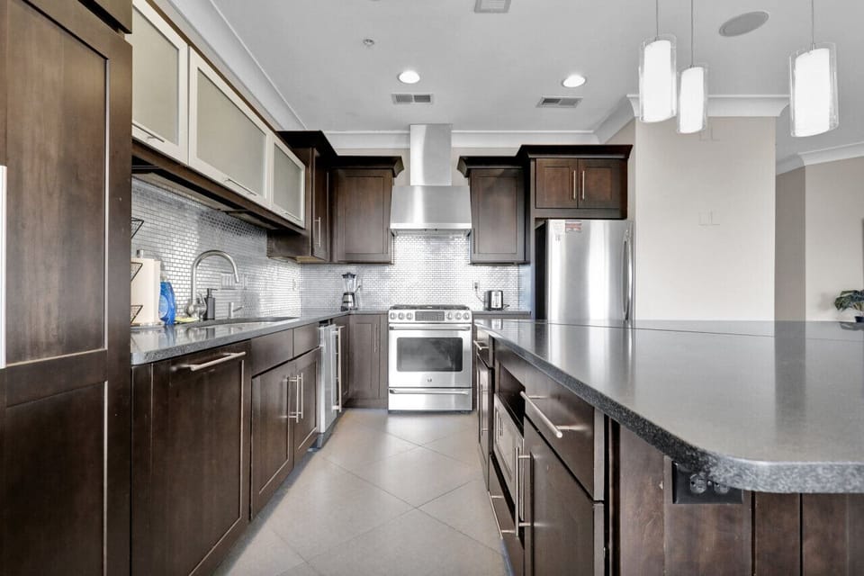 Whipping up delicious meals is a breeze in the fully-equipped kitchen, complete with high-end stainless-steel appliances.