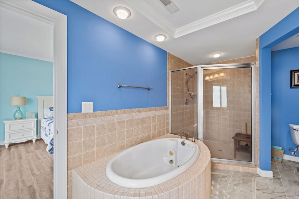 With a Spacious Walk-In Shower and a Soaking Tub.
