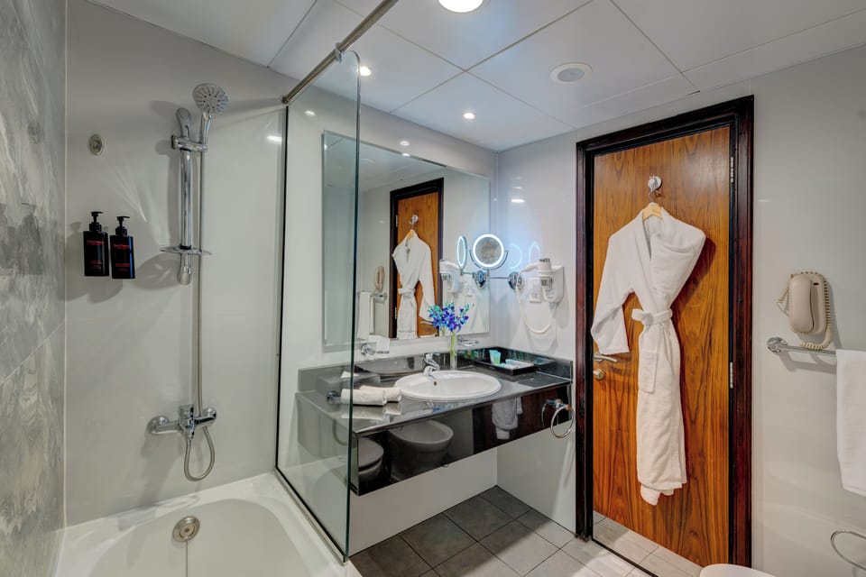 Shower, free toiletries, hair dryer, slippers