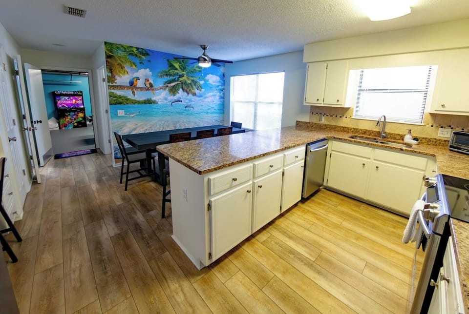 Kitchen and dining area with seating for many to enjoy morning coffee and meals together
