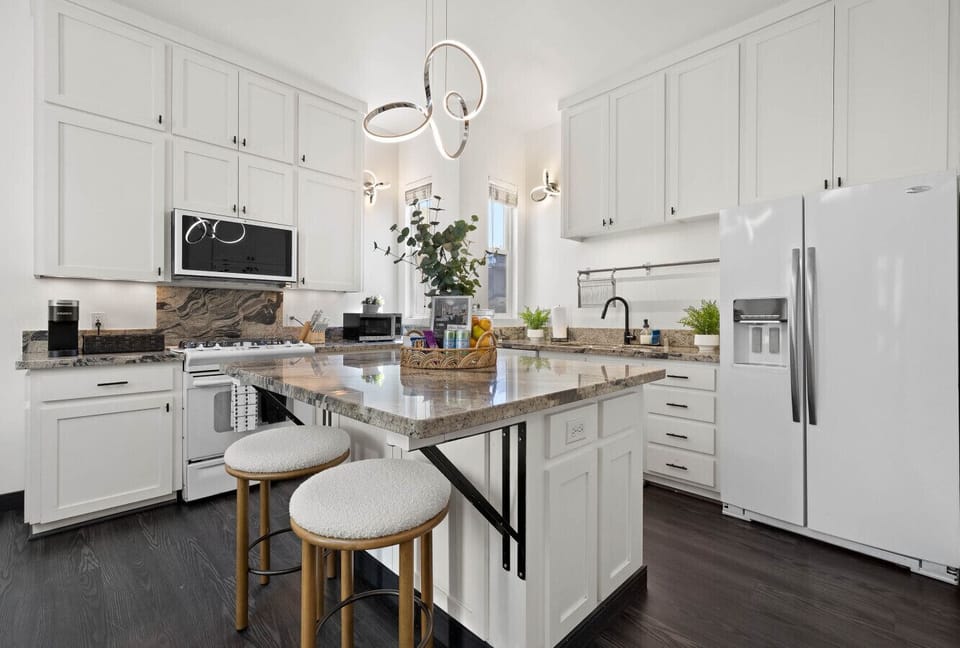 Modern kitchen w/ sleek cabinetry, ample counter space & everything needed to cook in.