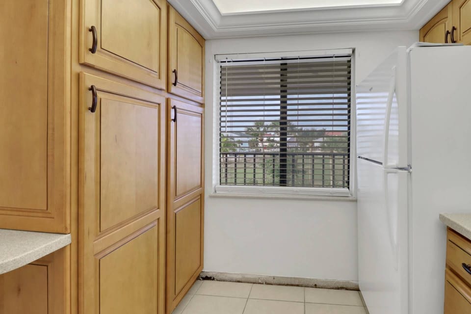 The open kitchen has abundant cabinets, full-size appliances and is well stocked with cookware, dinnerware and many kitchen tools and gadgets.
