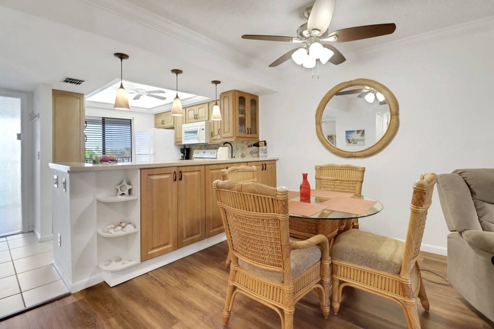 Enjoy a meal, a hand of cards or a game night gathered around the dining table for 4.