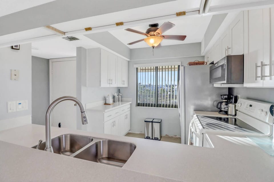 The kitchen has abundant cabinets, full-size appliances and is well stocked with cookware, dinnerware and many kitchen tools and gadgets.
