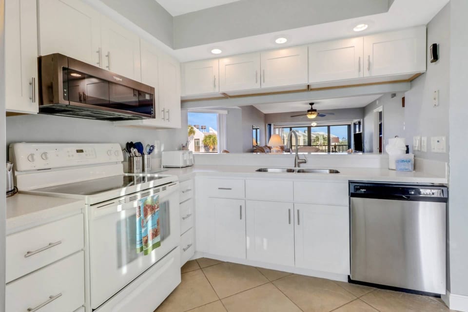The kitchen has abundant cabinets, full-size appliances and is well stocked with cookware, dinnerware and many kitchen tools and gadgets.