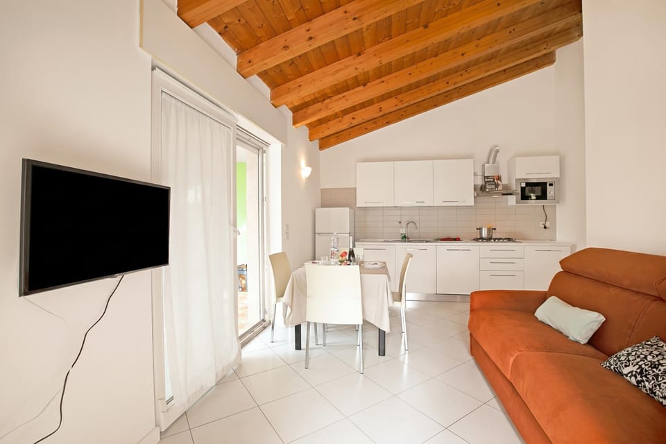Family House, Multiple Bedrooms (Sara’s Garden Home) | Living area | 21-inch flat-screen TV with cable channels, TV