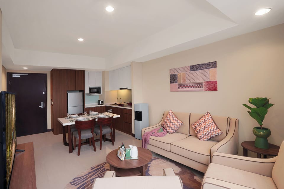 Premier Apartment, 2 Bedrooms | Living area | 32-inch flat-screen TV with satellite channels