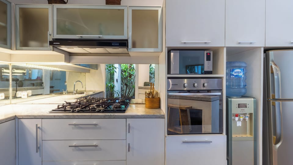 Villa | Private kitchen | Fridge, microwave, oven, stovetop
