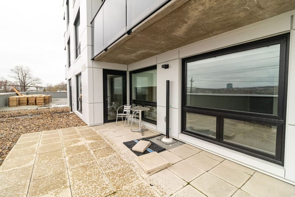 Private outdoor patio complete with a bistro table and chairs, offering a quiet open-air spot to unwind right outside your unit.