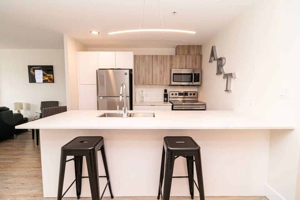 Fully equipped kitchen with premium appliances and ample counter space.