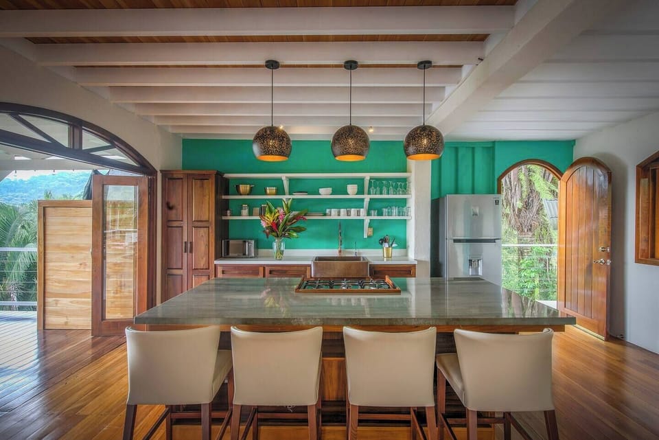 Open kitchen with panoramic balcony views.