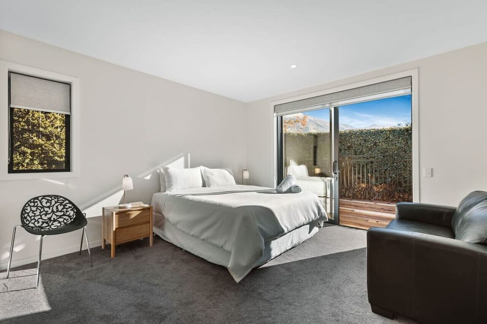 Bedroom 1: Master bedroom downstairs, with ensuite and deck access