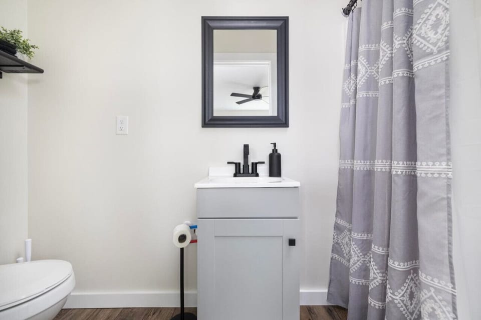 Fresh, clean, and stylish bathroom with updated features for a relaxing experience.