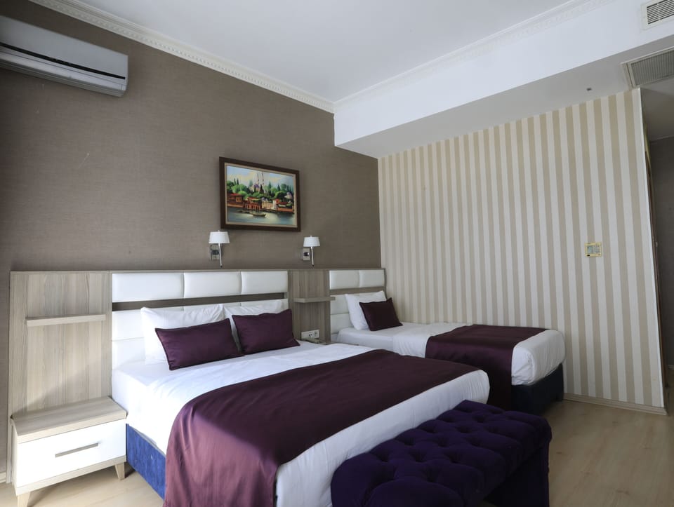 Standard Triple Room, City View | Desk, free WiFi, bed sheets
