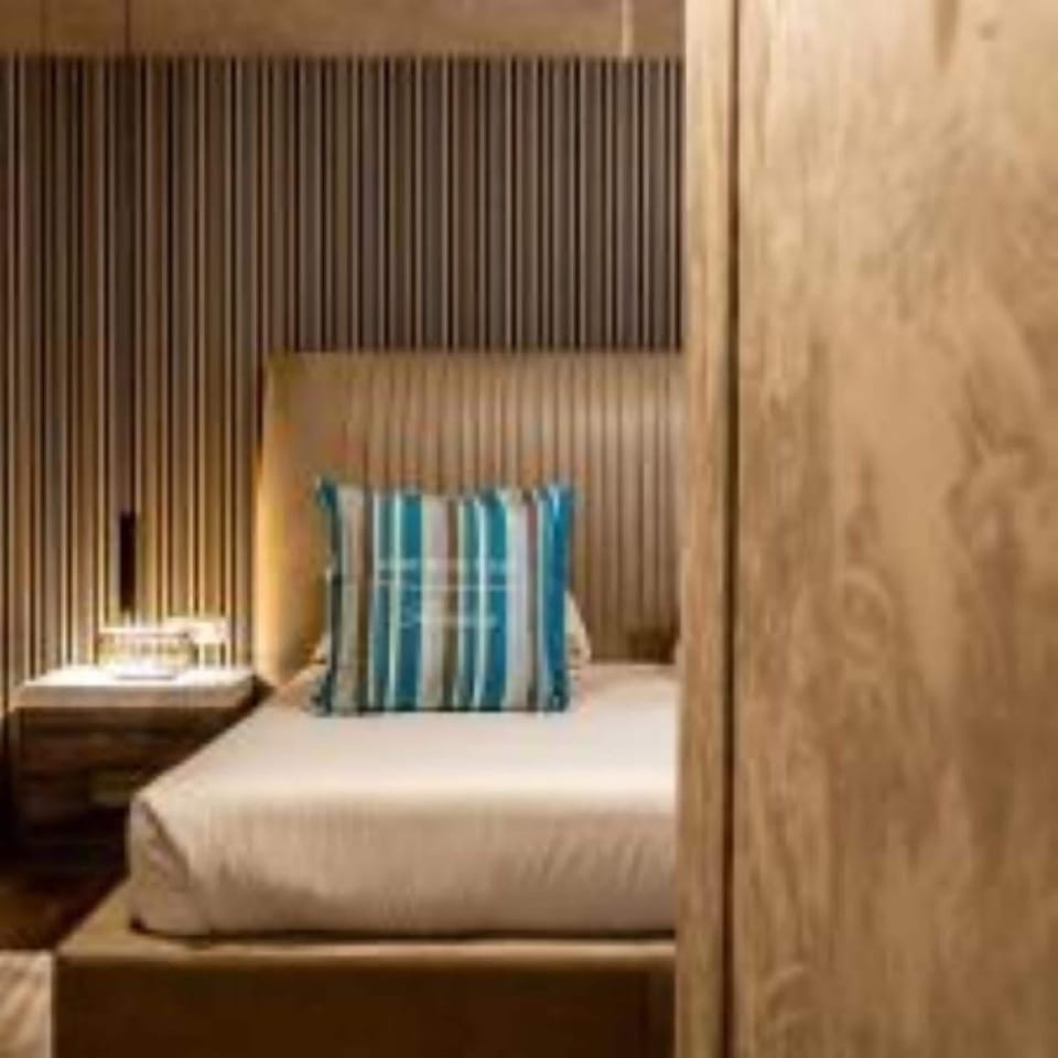 Premium bedding, down comforters, memory foam beds, free minibar