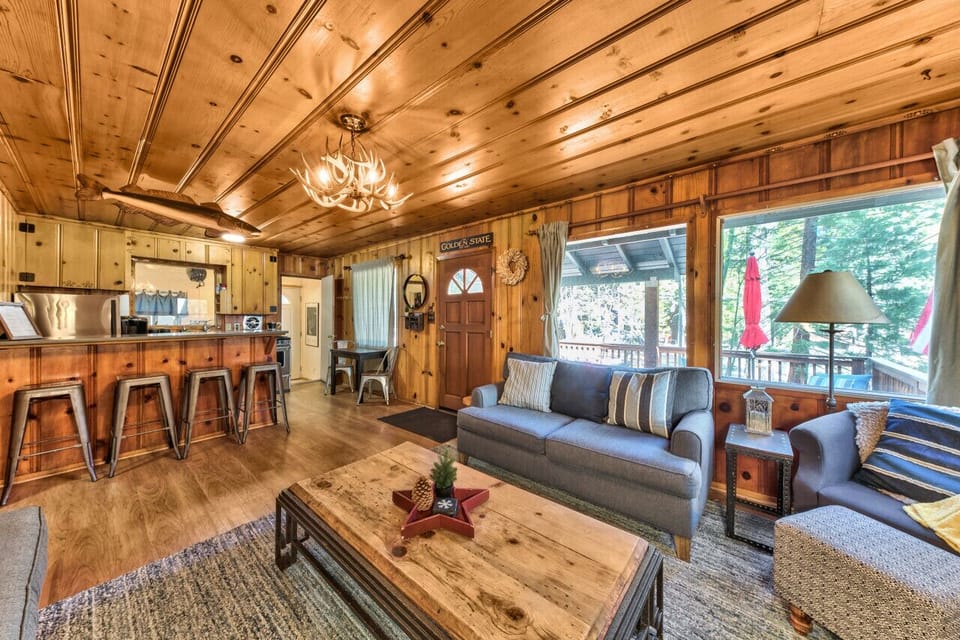 Cozy living room with gas fireplace adjacent to kitchen.