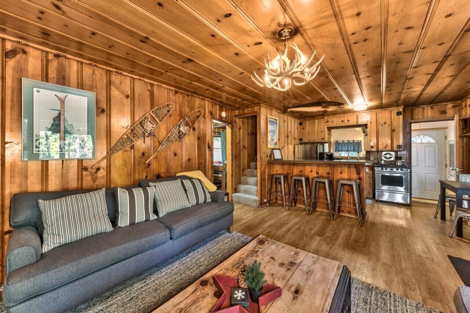 Cozy living room with gas fireplace adjacent to kitchen.