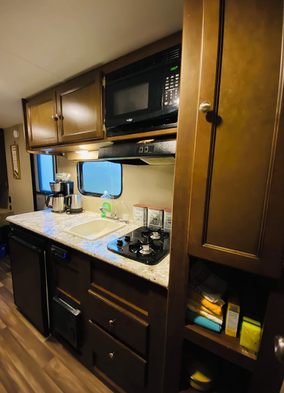 Kitchen area two burner stove top,fridge,microwave,toaster,kettle,coffee machine