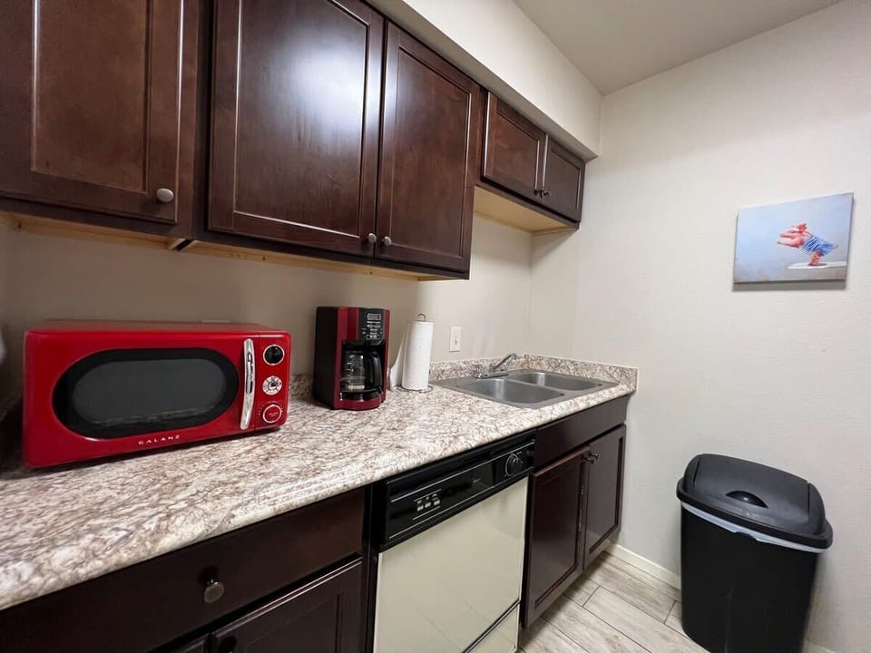 Done with Dinner clean your dishes just put them to wash.  A clean kitchen is a happy kitchen.