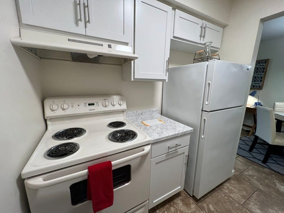 Full kitchen includes cookware and cooking utensils, dining ware