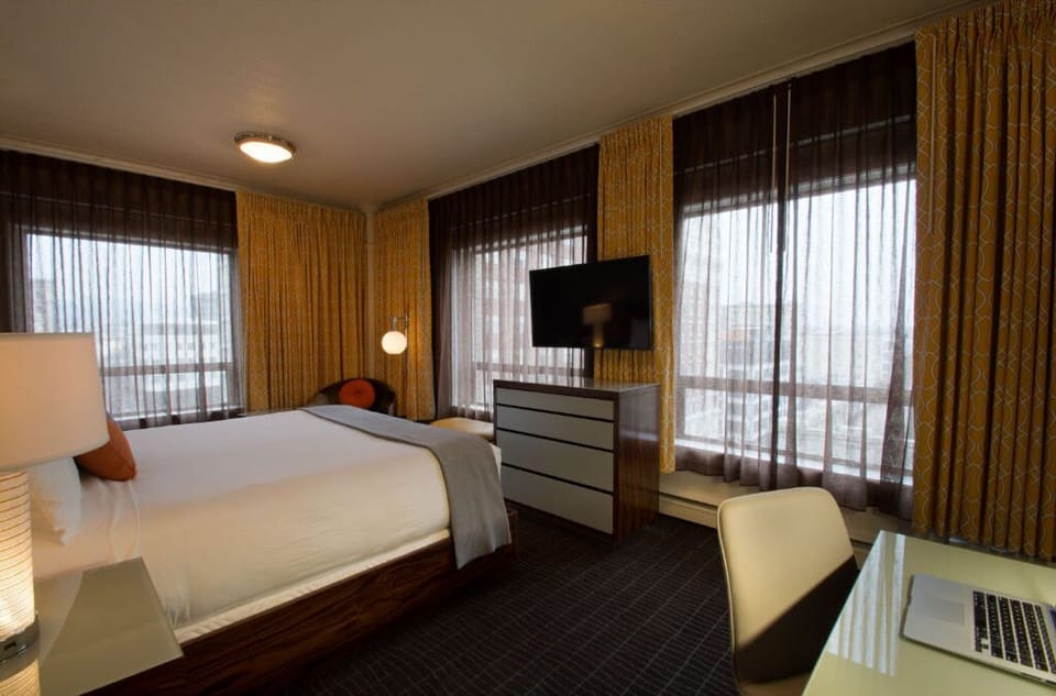 Spacious superior room with king bed and a dedicated workspace, ideal for both leisure and business travelers.