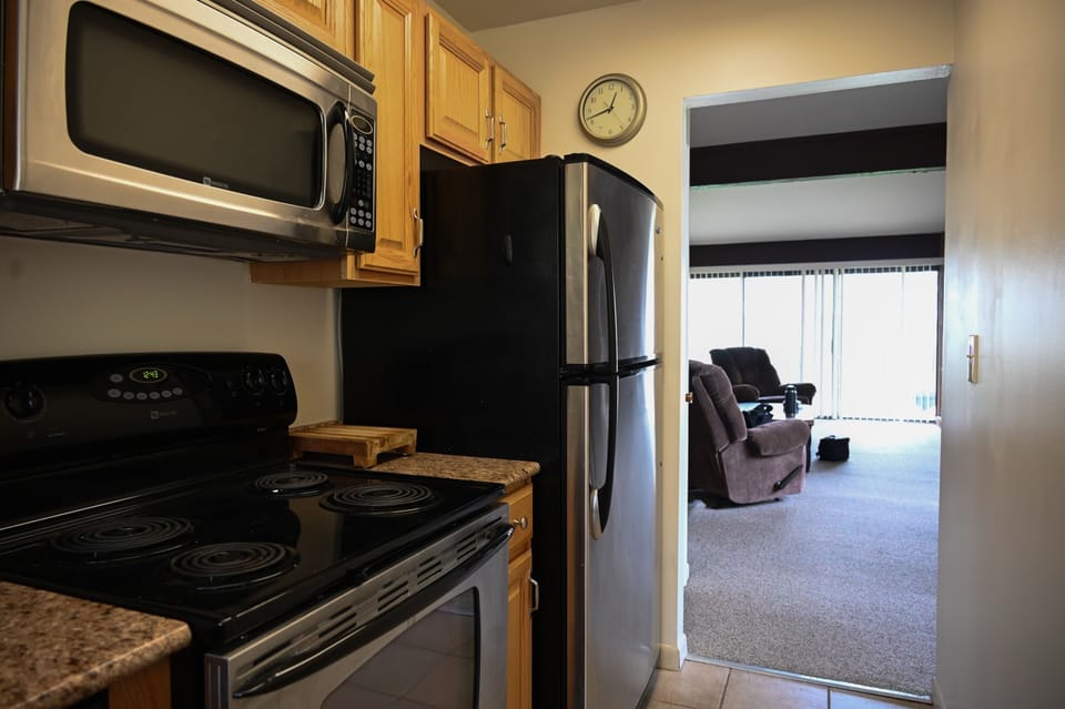 Galley-style kitchen stocked with all the essentials