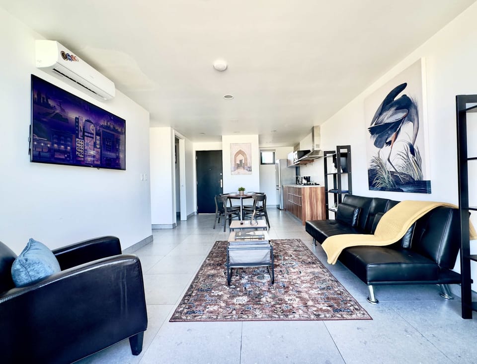 Living Room with:
Seating area
Futton
Smart TV
AC unit

