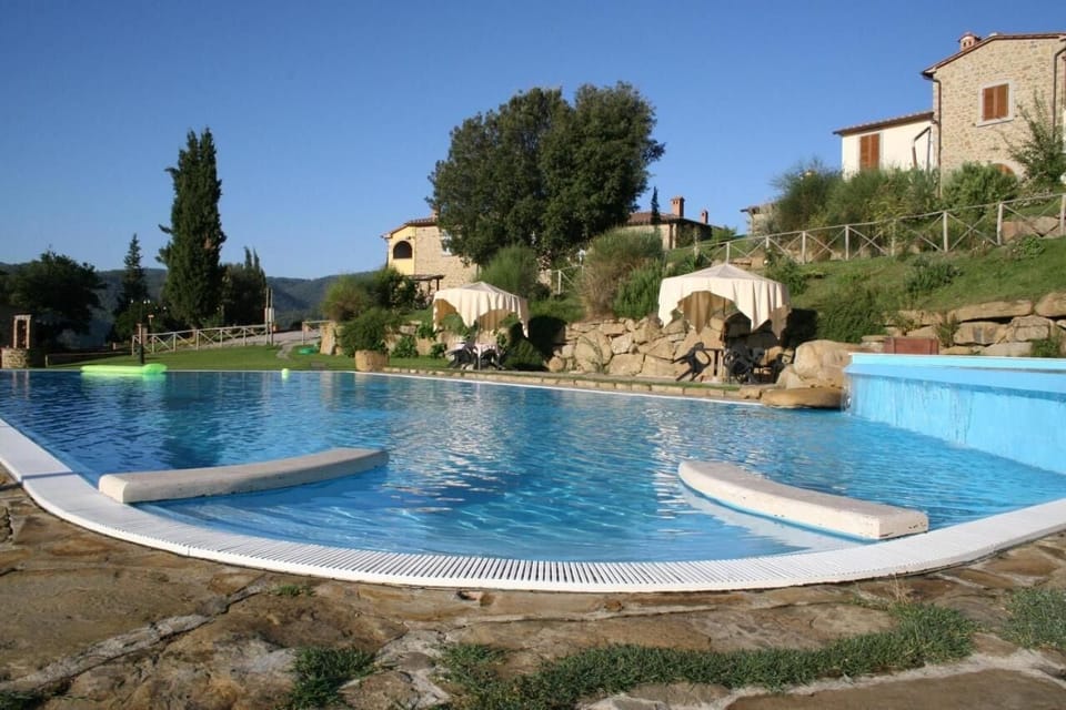 Seasonal outdoor pool, open 8:00 AM to 8:00 PM, pool umbrellas