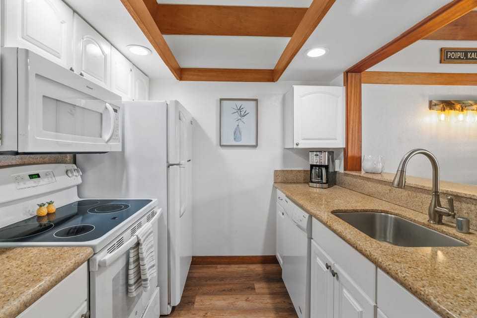 Full kitchen with Stove, oven, microwave and more.