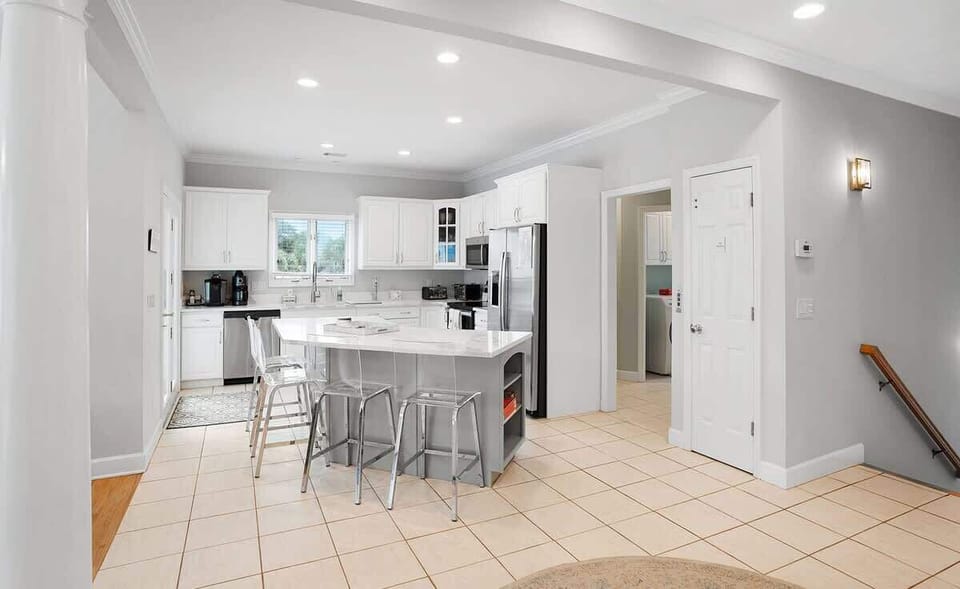 Open concept second floor living room, dining room and kitchen