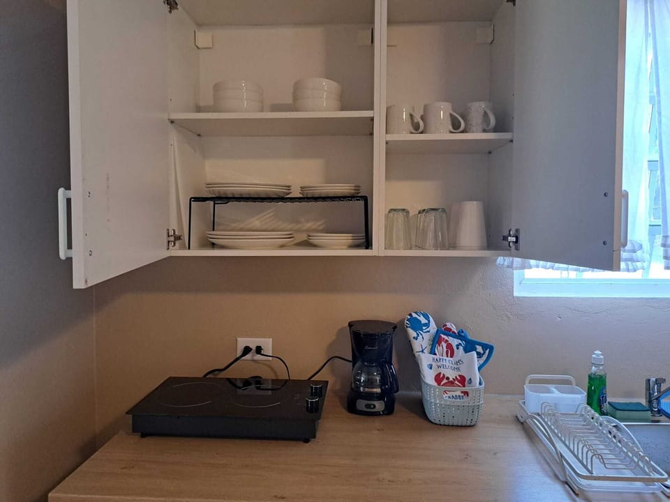 Cups and dishes provided, coffe pot, stove top 2 burner