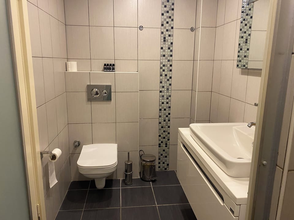 Family Room | Bathroom | Shower, hair dryer, slippers, towels