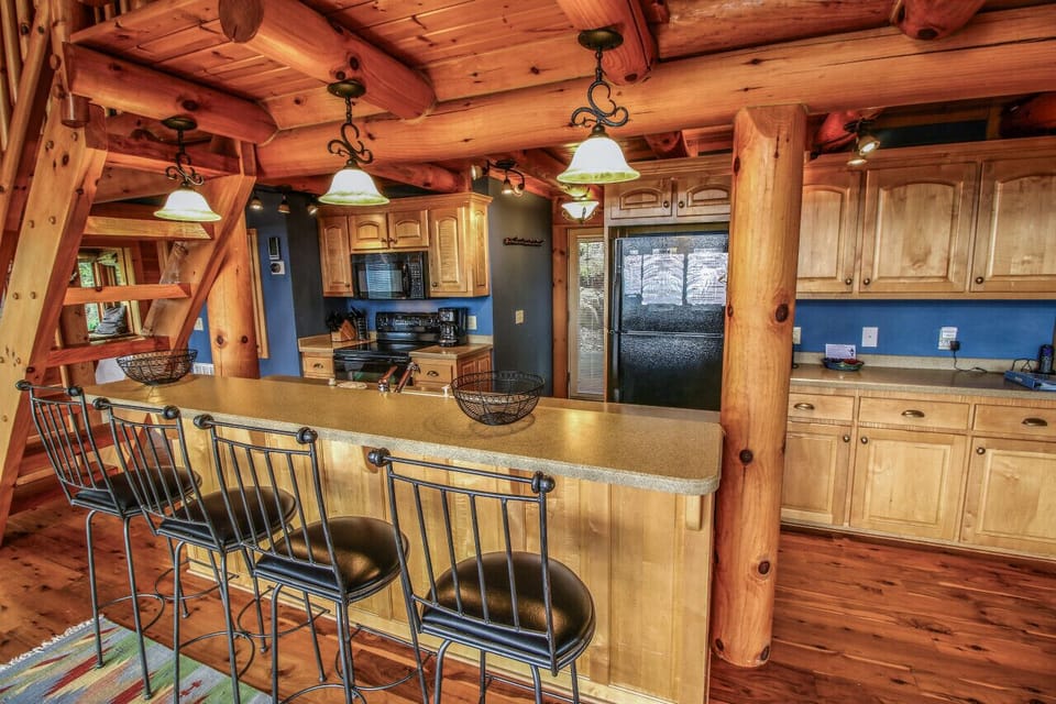 Everything you need, right where you need it - to include cabinet space to store groceries and supplies- cook, snack, or gather in this fully stocked kitchen.