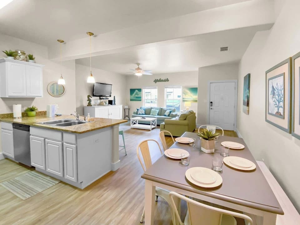 Stunning beach retreat for you and your guests!  Ground floor of this 2 story townhome consists living, dining, kitchen AND a master bedroom and full bathroom so you only need to go upstairs if you choose to visit the additional 3 sleeping areas and a full bath!!