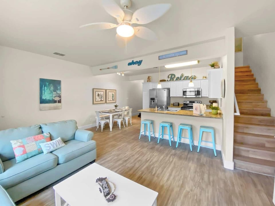 Gorgeous beach townhome ready to enjoy with your whole crew! Tons of space to prepare delicious meals or kick back and watch TV after a day at the beach!