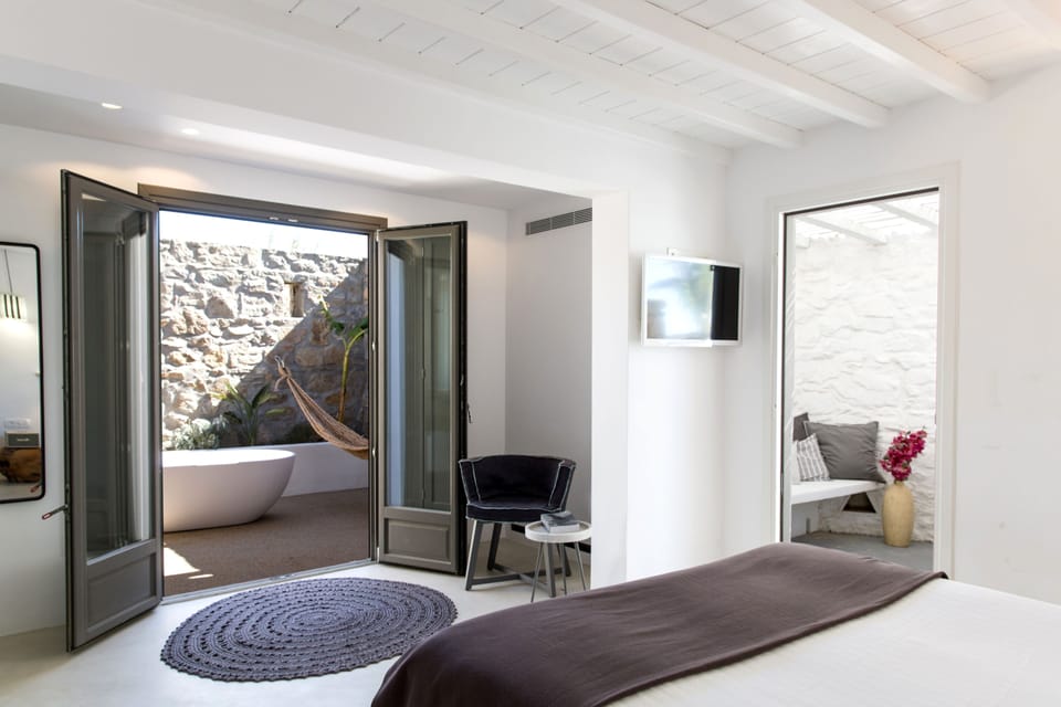 Deluxe Room, Partial Sea View | Premium bedding, down comforters, pillowtop beds, minibar