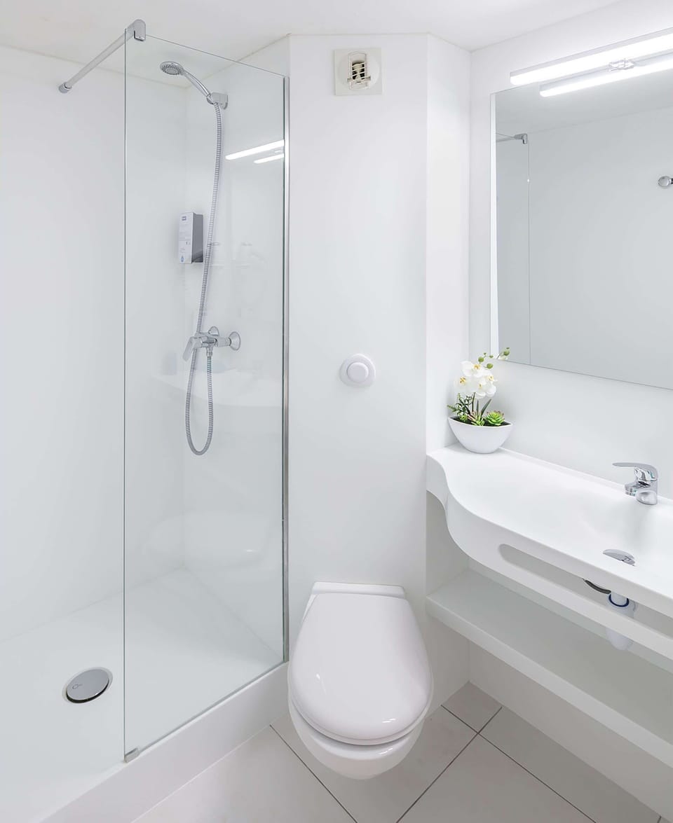 Shower, eco-friendly toiletries, hair dryer, towels