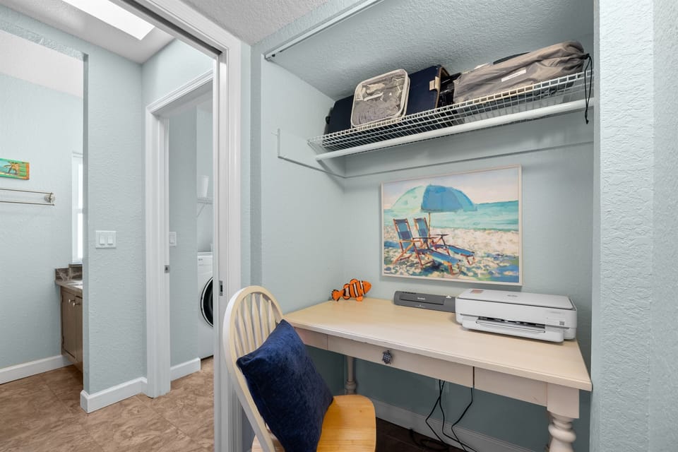 Office Nook: Bright workspace with beachy decor, perfect for planning coastal adventures!