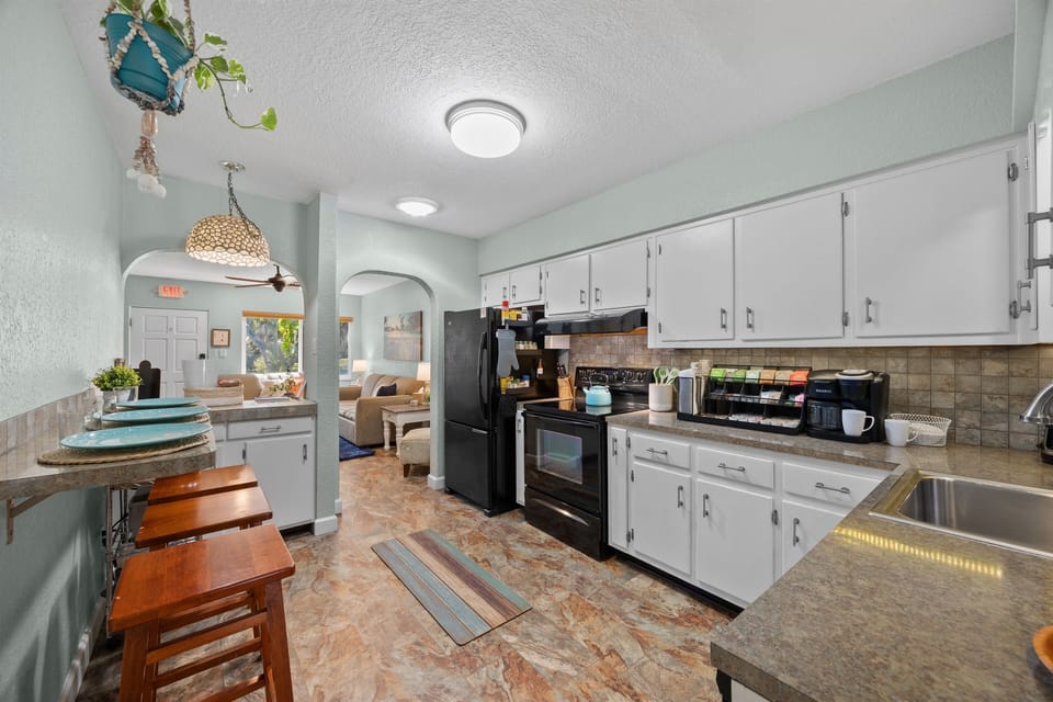 Kitchen: Whip up your favorite meals in this stylish kitchen with modern appliances and vibrant decor!