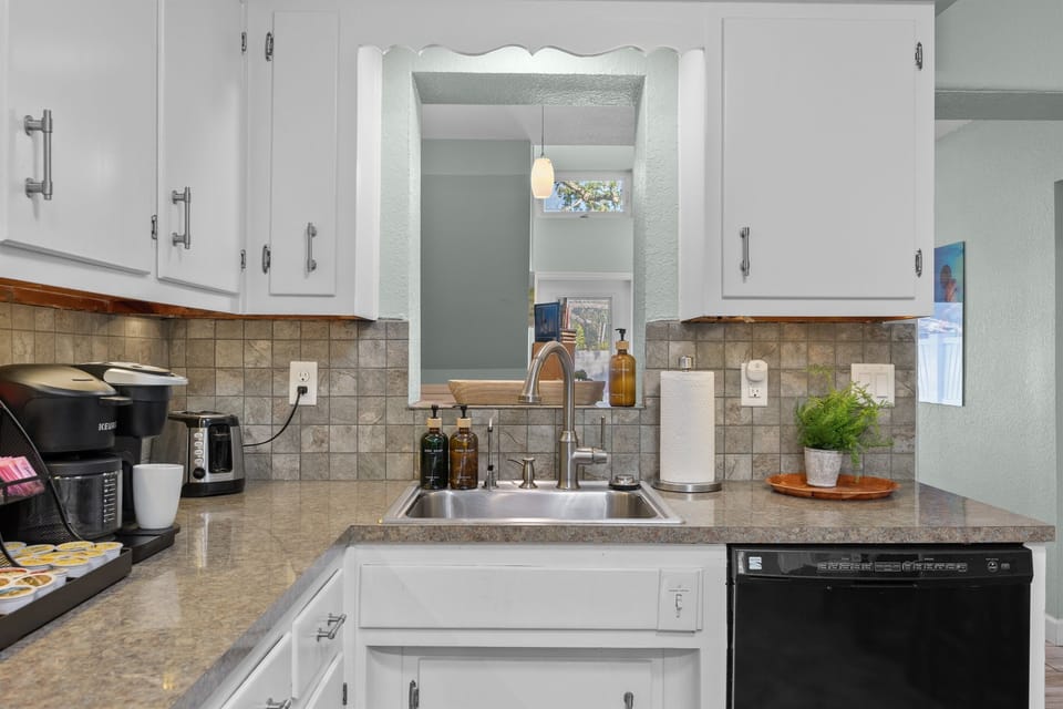 Kitchen Delight: Bright, modern space with sleek appliances and a vibrant coastal vibe!