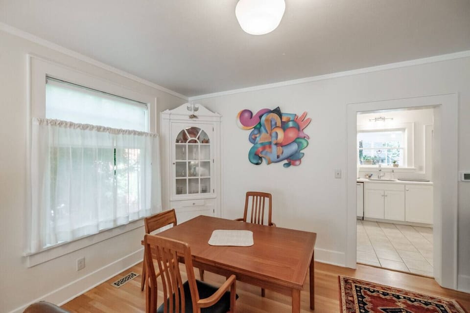 Dine together at a table that seats four and expands to accommodate six.