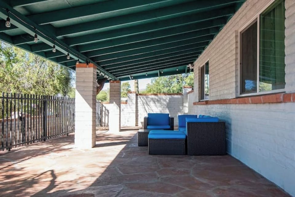 This  covered flagstone patio is street-facing.