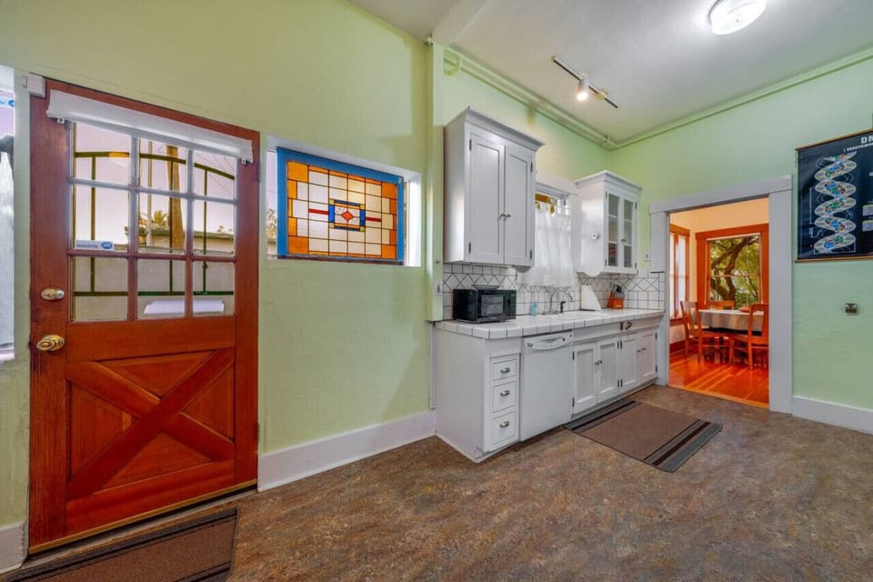 Updated, well-equipped kitchen with access to the porch and backyard