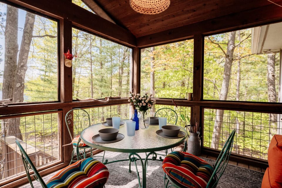 Screened-in porch cuddled in nature 🌿☕