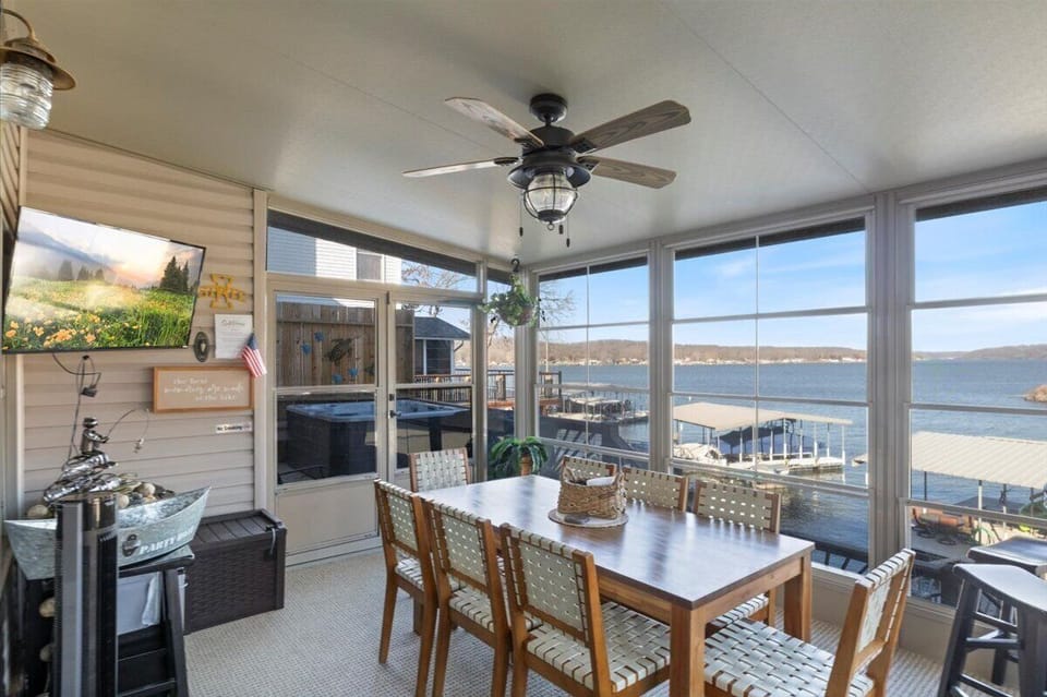 The deck will be your landing spot! Screened porch, Hot tub, Blackstone, and Grill, all with lake views!