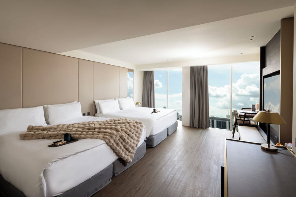 Deluxe Quad Room | Down comforters, pillowtop beds, minibar, in-room safe