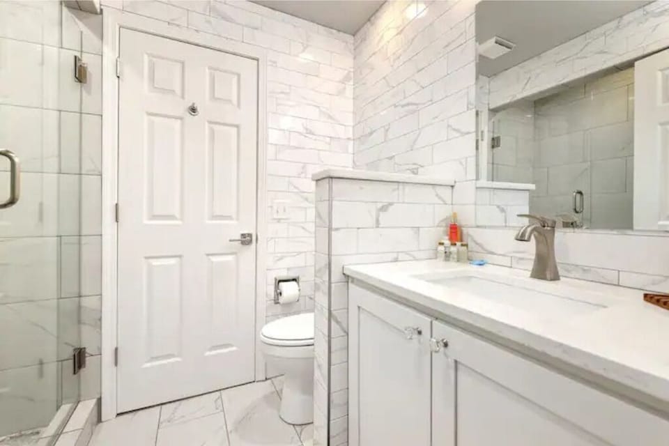 1st floor bathroom accessible from bedroom and living room hallway. 
