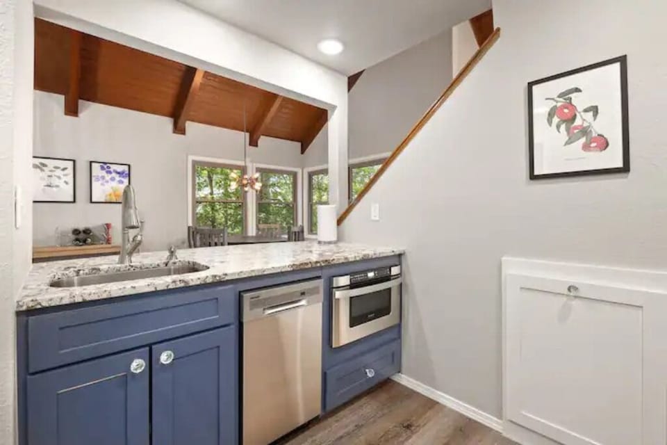 Dishwasher, pullout microwave, cleaning supplies under sink if needed.